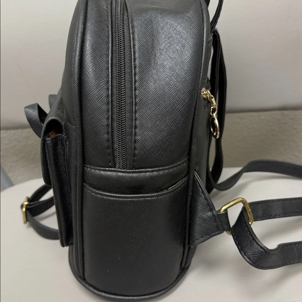 Black Backpack with Gold Accents